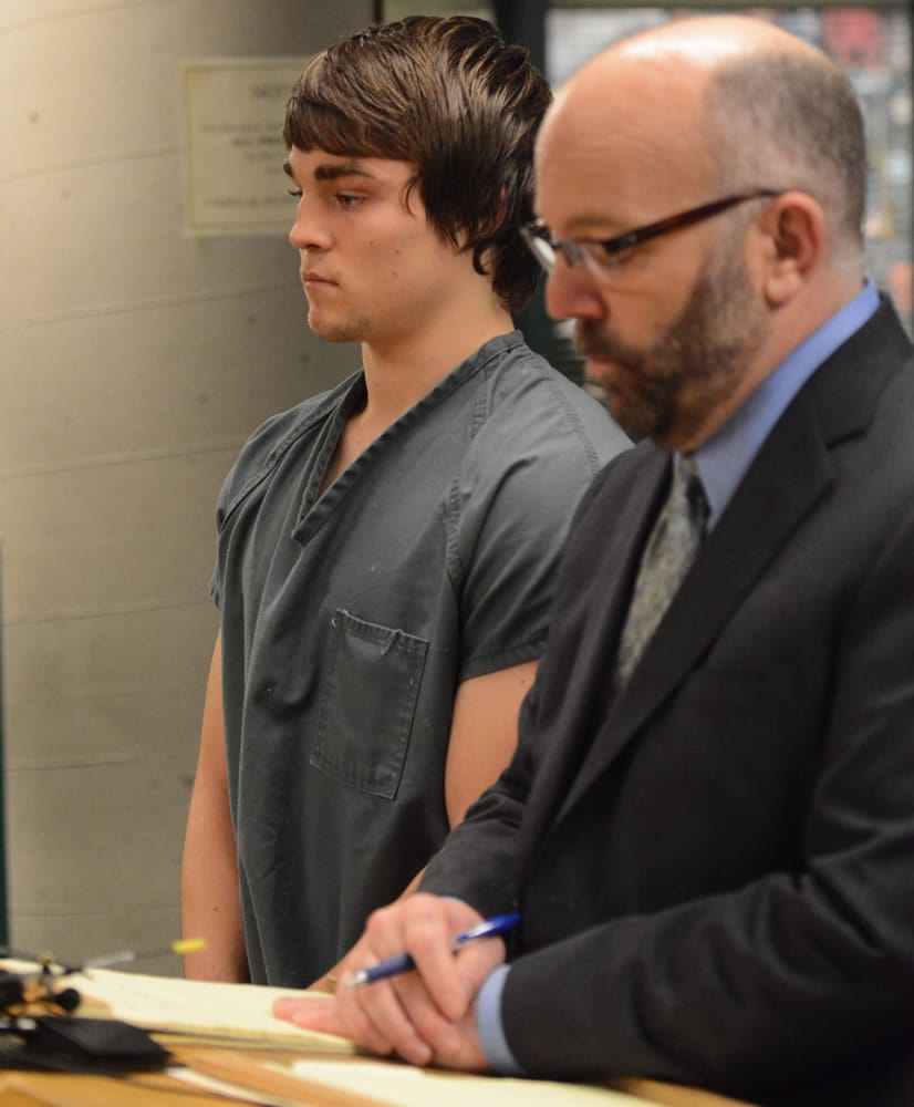 Western Washington University student Tysen Campbell, left, makes his first appearance Tuesday with his attorney Bob Butler, as he is charged with malicious harassment in Whatcom Superior Court in Bellingham. (Philip A.