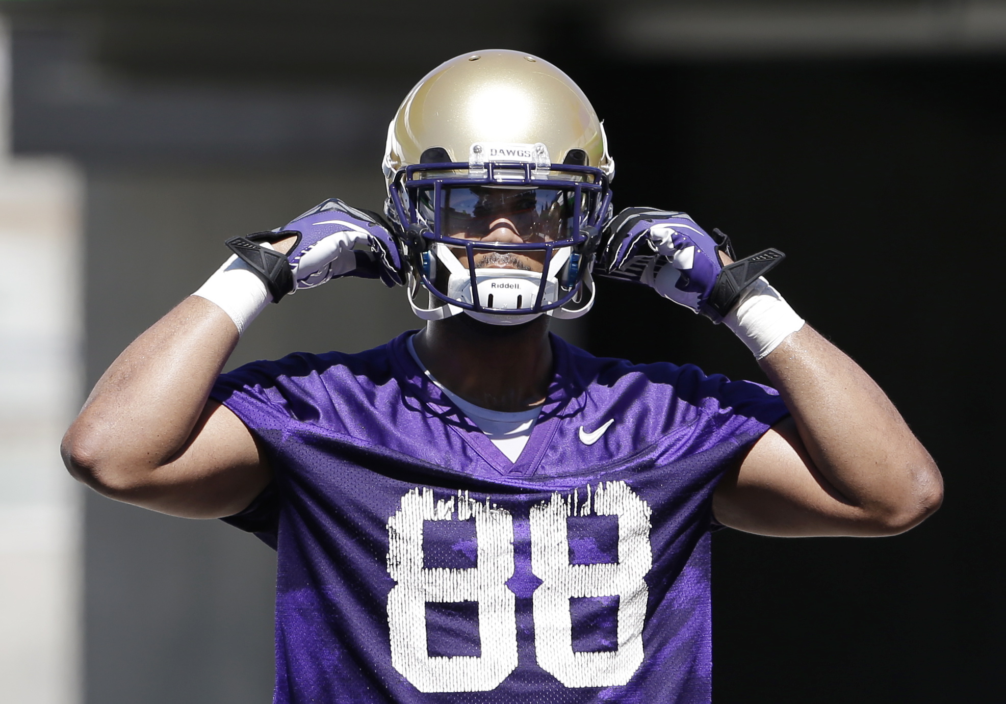 Washington's Austin Seferian-Jenkins adjusts his helmet at the team's first football practice earlier this month.
