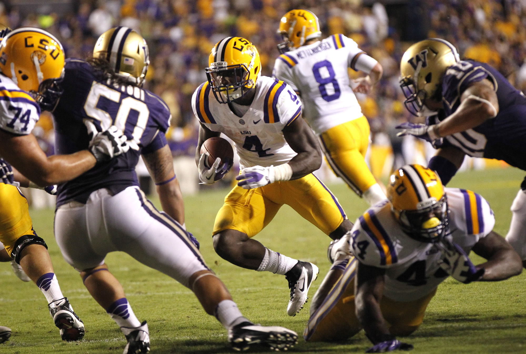 LSU running back Alfred Blue (4) rushes for a portion of his 101 yards Saturday against Washington.