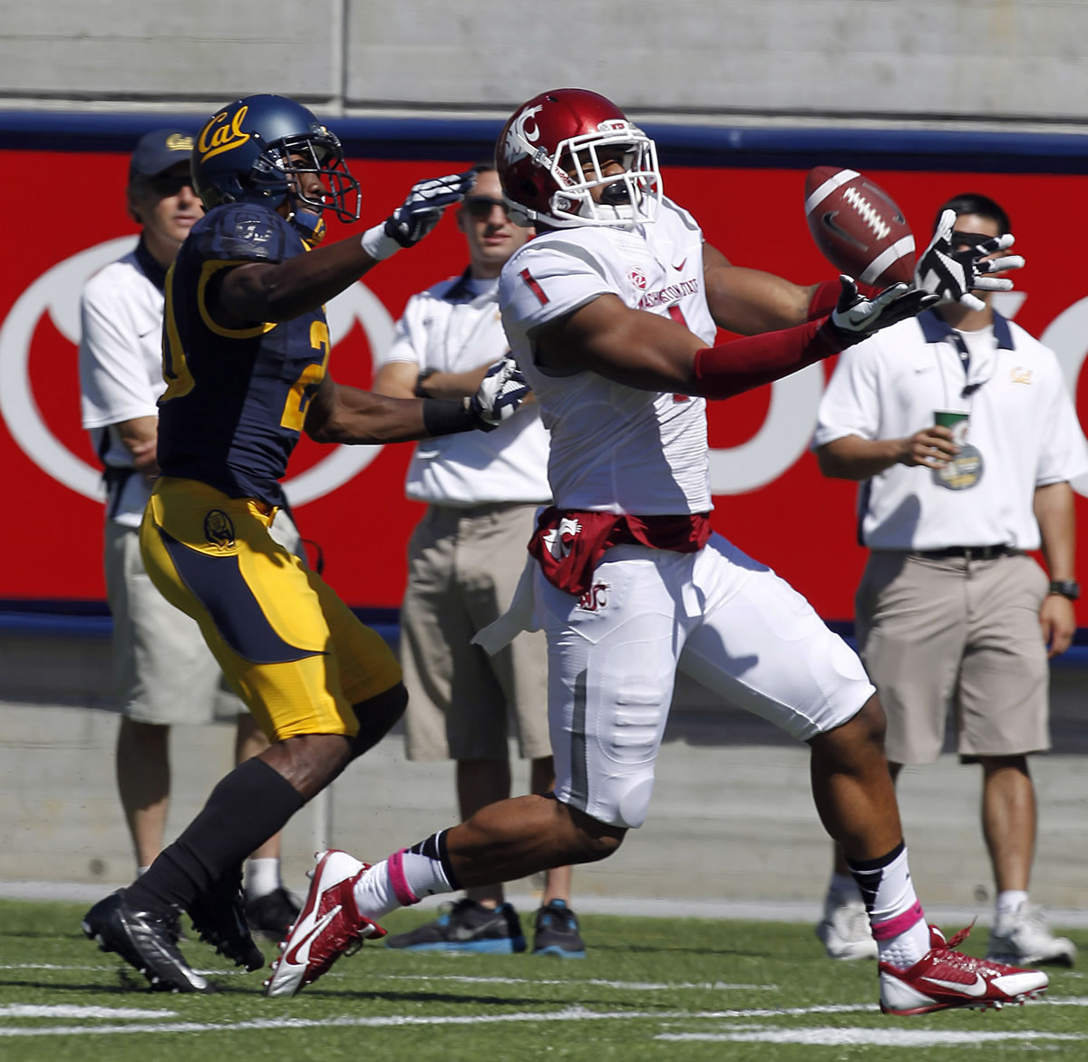 Washington State wide receiver Vince Mayle (1) catches a touchdown pass against California defensive back Isaac Lapite (20) during the first half Saturday.