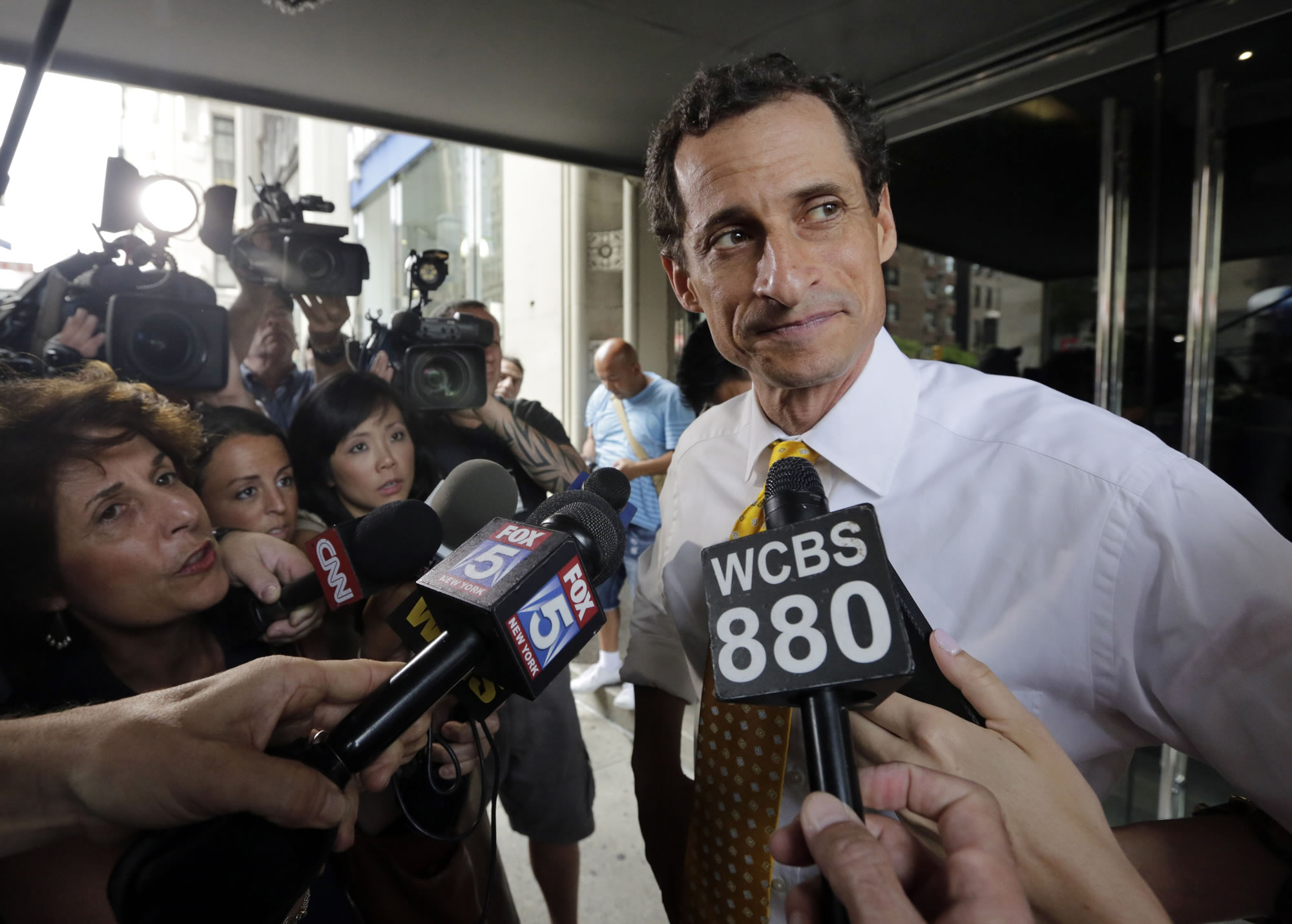 New York City mayoral candidate Anthony Weiner leaves his apartment building in New York on Wednesday.