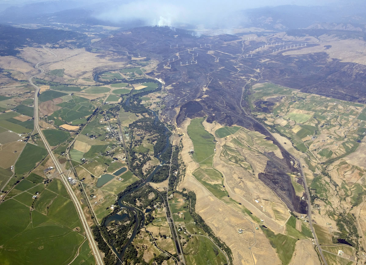 Gordon King/Yakima Herald-Republic
In this aerial photo taken Thursday, the Taylor Bridge Fire burns near Cle Elum. The wildfire has burned across an estimated 22,000 acres, roughly 35 square miles, of diverse terrain, ranging from grasses to sagebrush to thick timber.