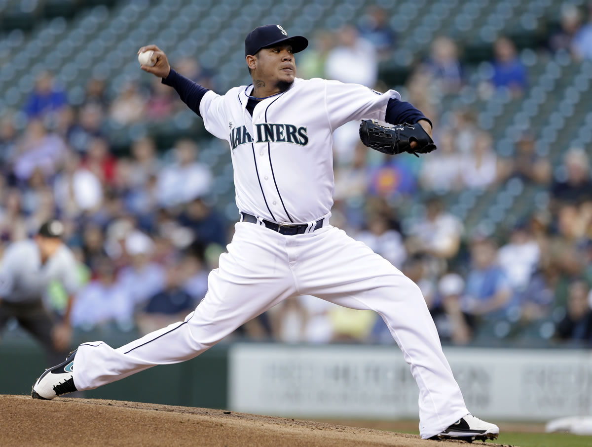 Seattle Mariners starting pitcher Felix Hernandez throws to a Chicago White Sox batter in the first inning of a baseball game Tuesday, June 4, 2013, in Seattle.