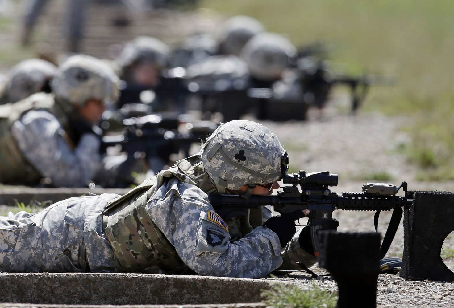 Female soldiers from 1st Brigade Combat Team, 101st Airborne Division train on a firing range while testing new body armor in Fort Campbell, Ky., in 2012, in preparation for their deployment to Afghanistan.