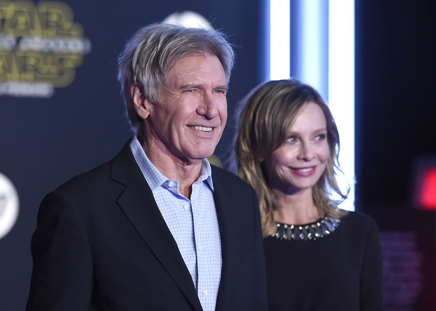 Harrison Ford, left, and Calista Flockhart arrive at the world premiere of "Star Wars: The Force Awakens" at the TCL Chinese Theatre on Monday, Dec. 14, 2015, in Los Angeles. Ford plays the role of Han Solo in the film.