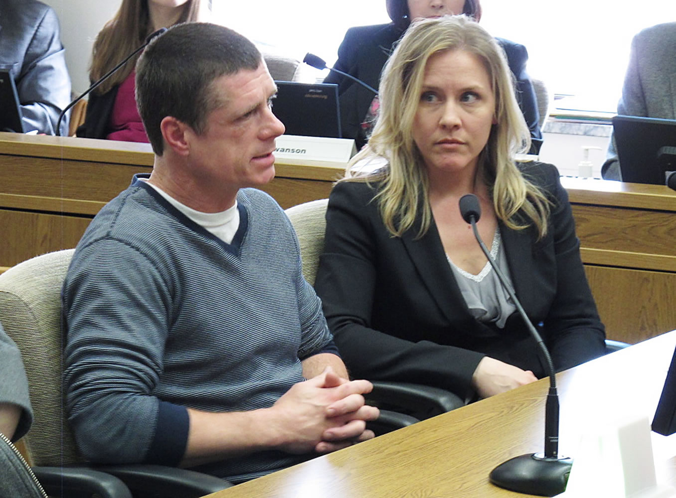 Alan Northrop, left, testifies before the Senate Law and Justice Committee in Olympia as Lara Zarowsky, right, of the Innocence Project Northwest, looks on.