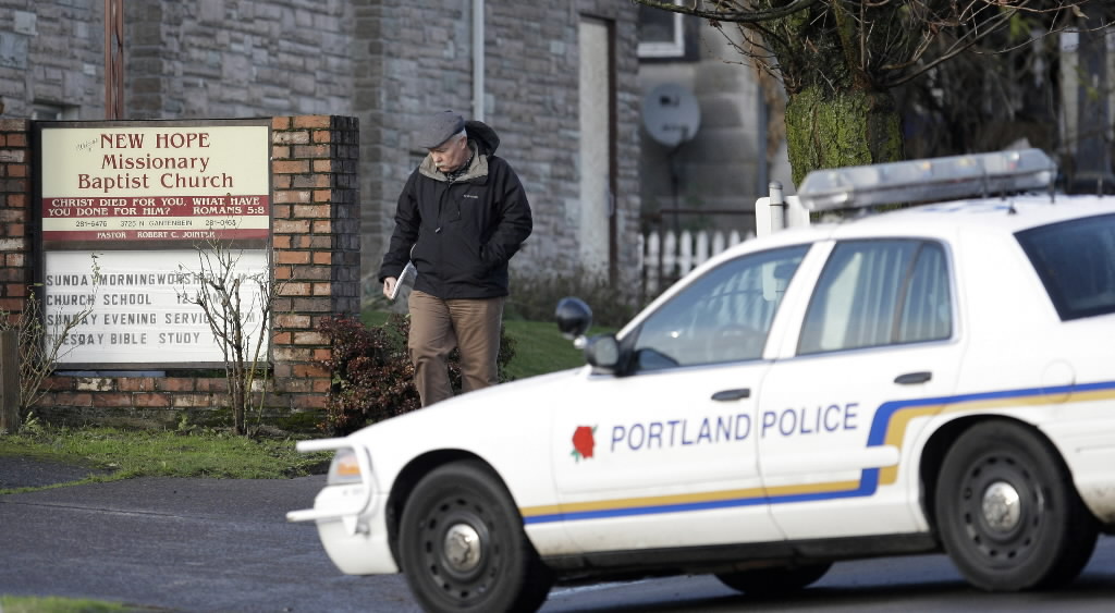 A Portland police detective investigates a crime scene in 2008. The U.S.