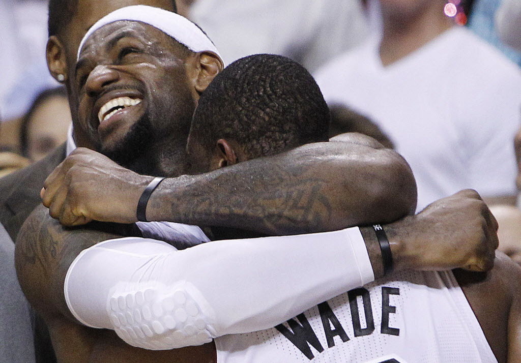 Miami's LeBron James and Dwyane Wade celebrate winning the NBA title on Thursday.