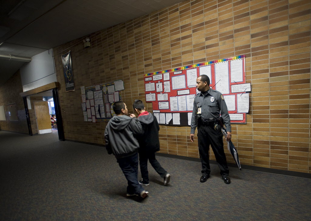 Vancouver Public Schools Resource Officer Donald &quot;Raven&quot; Hubbard makes sure children are headed to class at the start of the school day at McLoughlin Middle School on Feb.