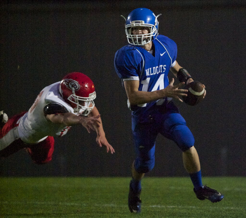 La Center quarterback Dylan King scrambles in the first half against Castle Rock at La Center Middle School on Friday.