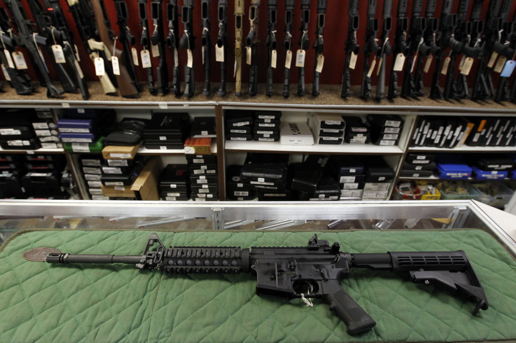 An AR-15 style rifle is displayed at the Firing-Line indoor range and gun shop in Aurora, Colo.