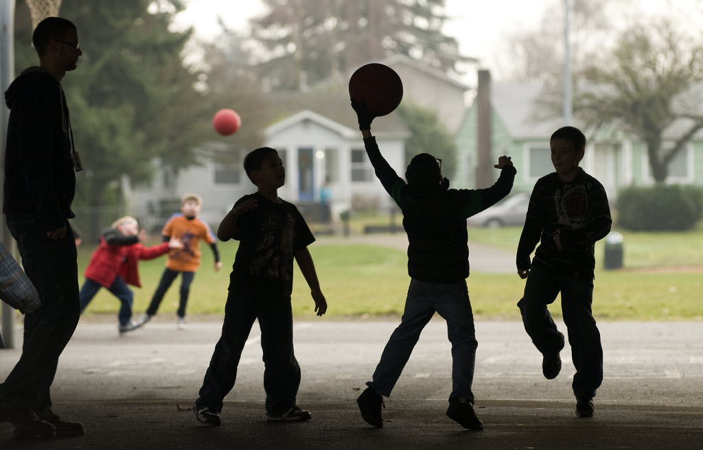 Kids in the Vancouver-Clark Parks and Recreation's Kids First After School program play wall ball at the Washington Elementary School playground in January.