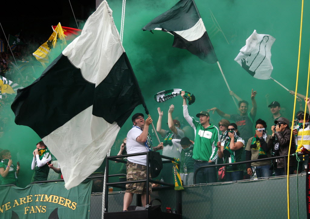 Portland Timbers fans celebrate after their team scored in the first half Sunday against the Seattle Sounders.