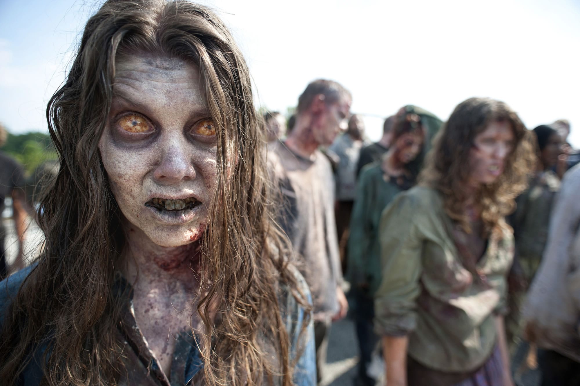 Zombies wander in a scene from the second season of the AMC series &quot;The Walking Dead&quot; in Senoia, Ga.