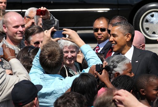 President Barack Obama greets supporters upon his arrival today at the 142nd Fighter Wing Oregon Air National Guard Base, in Portland.