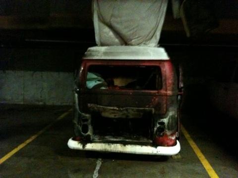 The remains of a Volkswagen van smolder inside the Vancouvercenter parking garage after a fire on Friday.