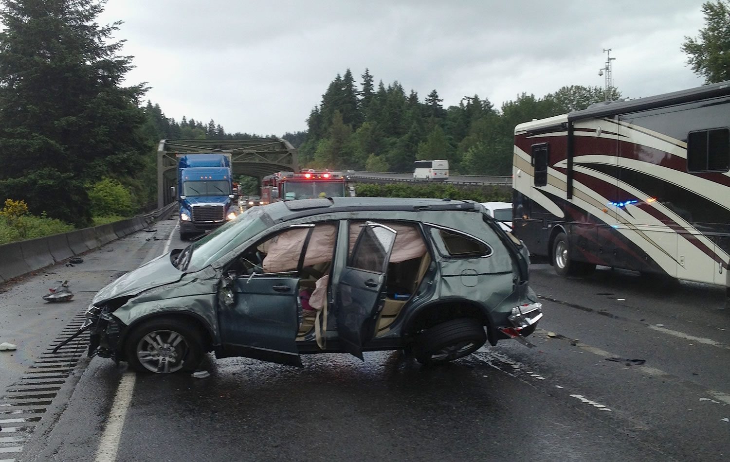 An SUV overturned in rainy conditions early Tuesday afternoon on Interstate 5 north of the East Fork Lewis River Bridge.