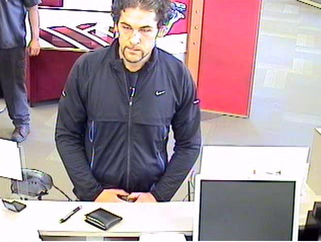 Vancouver police released this image from Wednesday's robbery of a Bank of America branch on Northeast Auto Mall Drive. Police on Thursday linked Brent J.