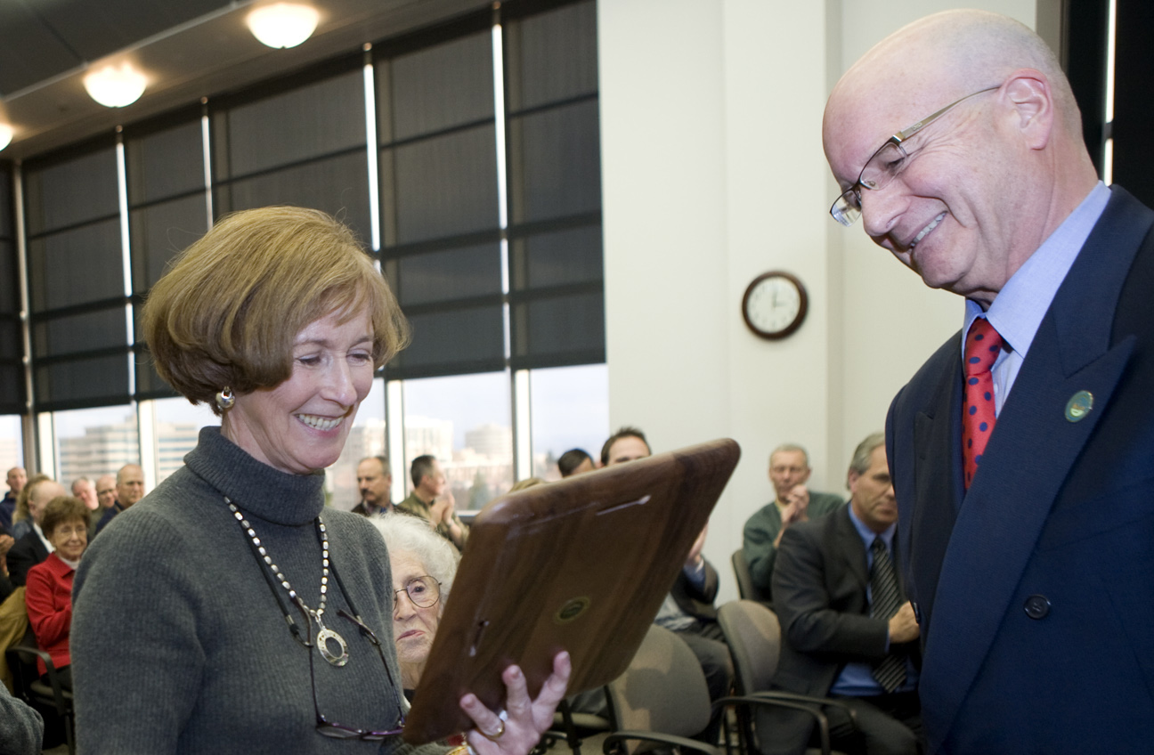 County Administrator Bill Barron gives former Clark County Commissioner Betty Sue Morris a plaque during Morris' retirement reception and 67th birthday celebration in December 2008.