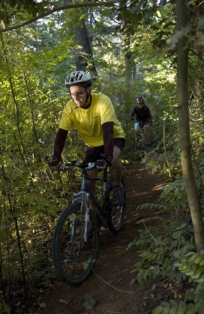 Travis Vaughan and his wife Marci Hansen, from Vancouver, enjoy a mountain bike ride near Round Lake in Camas.