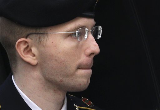 Army Pfc. Bradley Manning is escorted into a courthouse in Fort Meade, Md., on Wednesday before a sentencing hearing in his court martial. The military judge overseeing Manning's trial sentenced Bradley Manning to 35 years in prison for giving U.S.