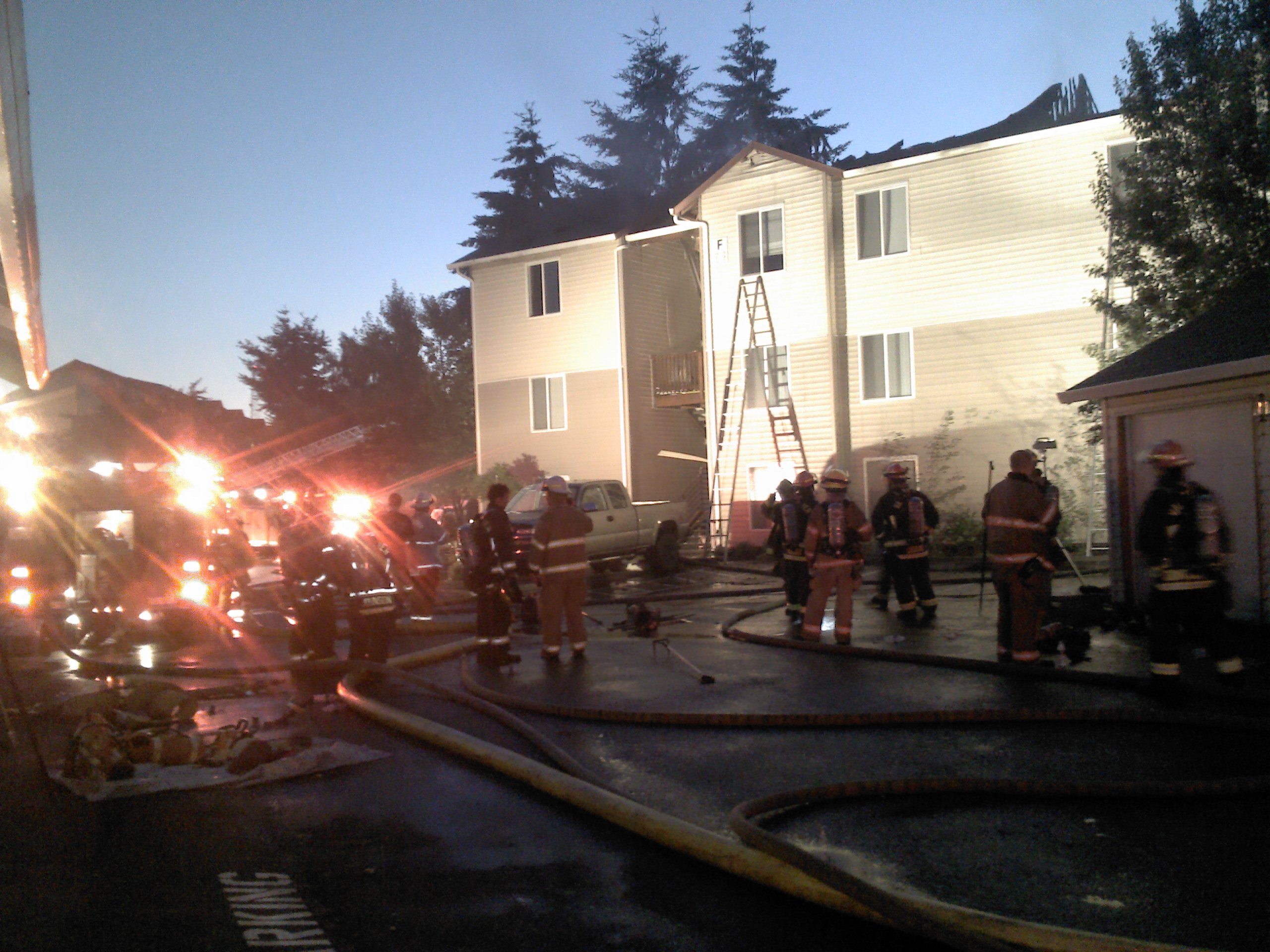 Firefighters remained on scene late Tuesday at the One Lake Place residential complex on Northeast 121st Avenue in Vancouver after one of its buildings burned.