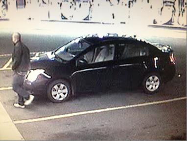 This surveillance photo apparently shows suspect Pedro &quot;Junior&quot; Godinez Jr. with a car stolen from an Oregon man on Nov.