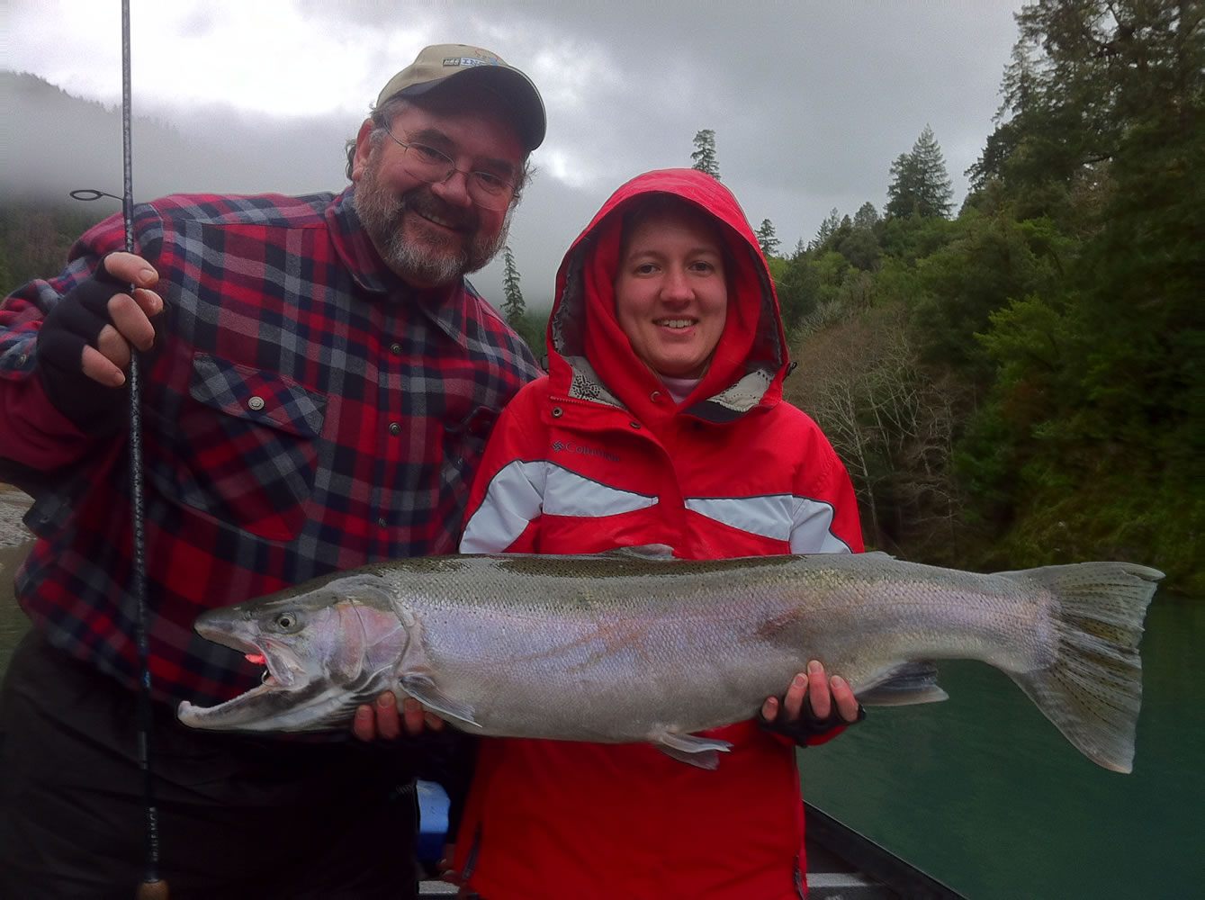 Emma Winter of Independence, Ore., holds a 21-pound hatchery steelhead she caught while fishing the Chetco River with her father, Orie.