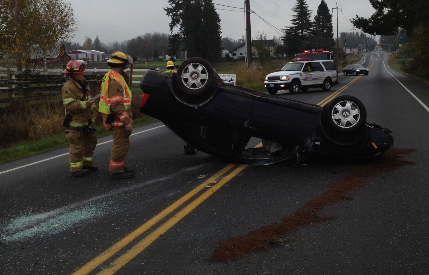 A rolled car blocked Northeast 10th Avenue in Ridgefield for about 20 minutes Tuesday morning.