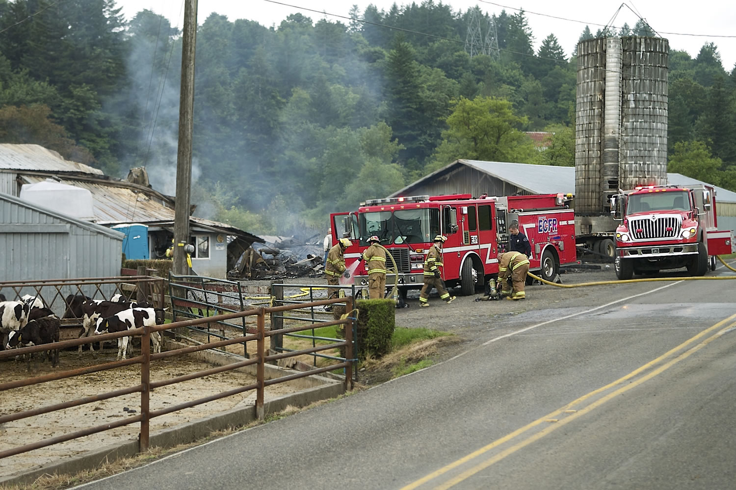 Firefighters returned to Stauffer's Dairy Farm near Washougal on Monday morning after an overnight fire rekindled.