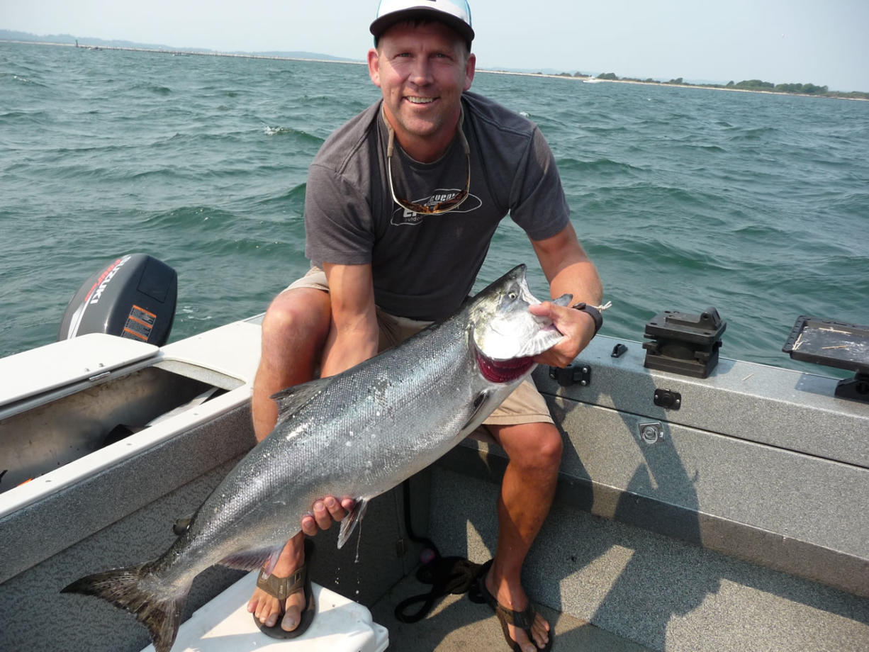 Doug Borneman of Bellingham poses with a chinook he caught in the Columbia River estuary in August.
