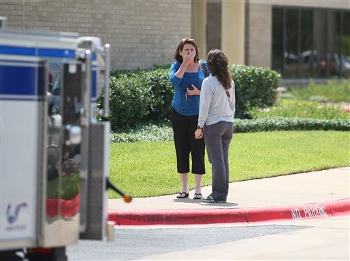 A woman reacts outside of the College Station Medical Center Monday in College Station, Texas where five victims were brought, following a shooting near the Texas A&amp;M campus.