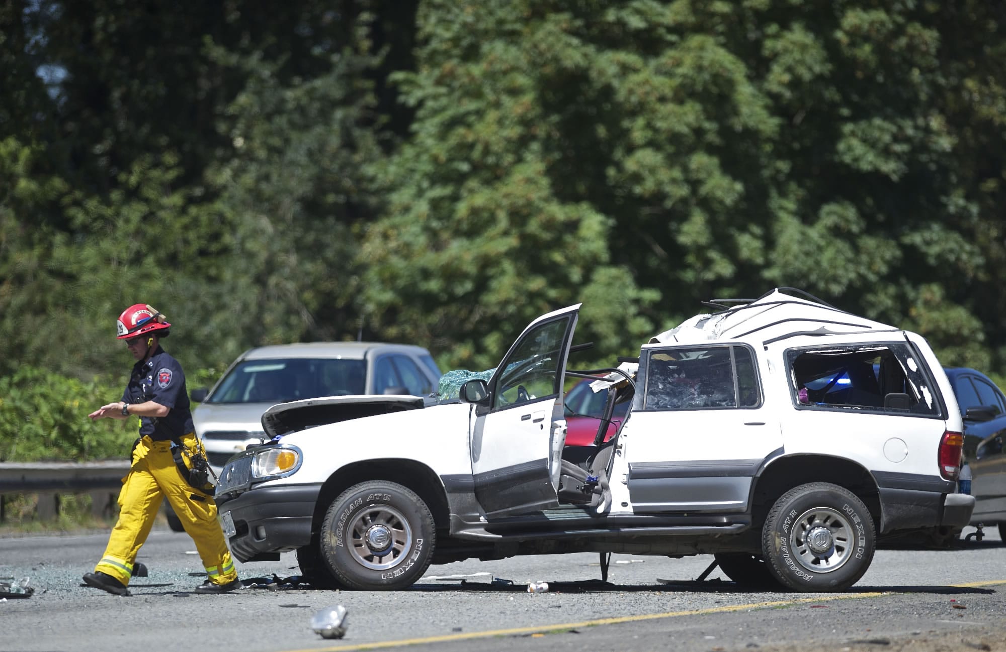 First responders work at the scene of a fatal accident on southbound Interstate 5 just south of the Woodland on Tuesday.