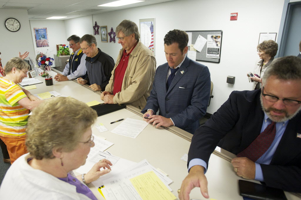 Ron Onslow, from left, Donald Stose, Dean Bloemke, Tim Leavitt and Sean Guard file paperwork at the Clark County Elections Office on Monday morning to become candidates in the upcoming election.