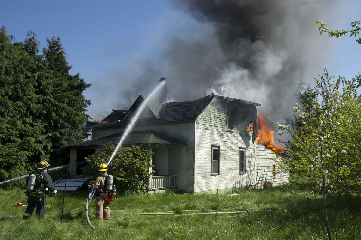 Fire destroys an abandoned house near the intersection of N.E.