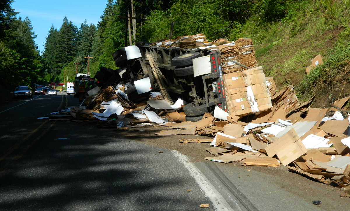 Rollover crash involving a tractor-trailer rig spilled 90,000 pounds of recycled cardboard.
