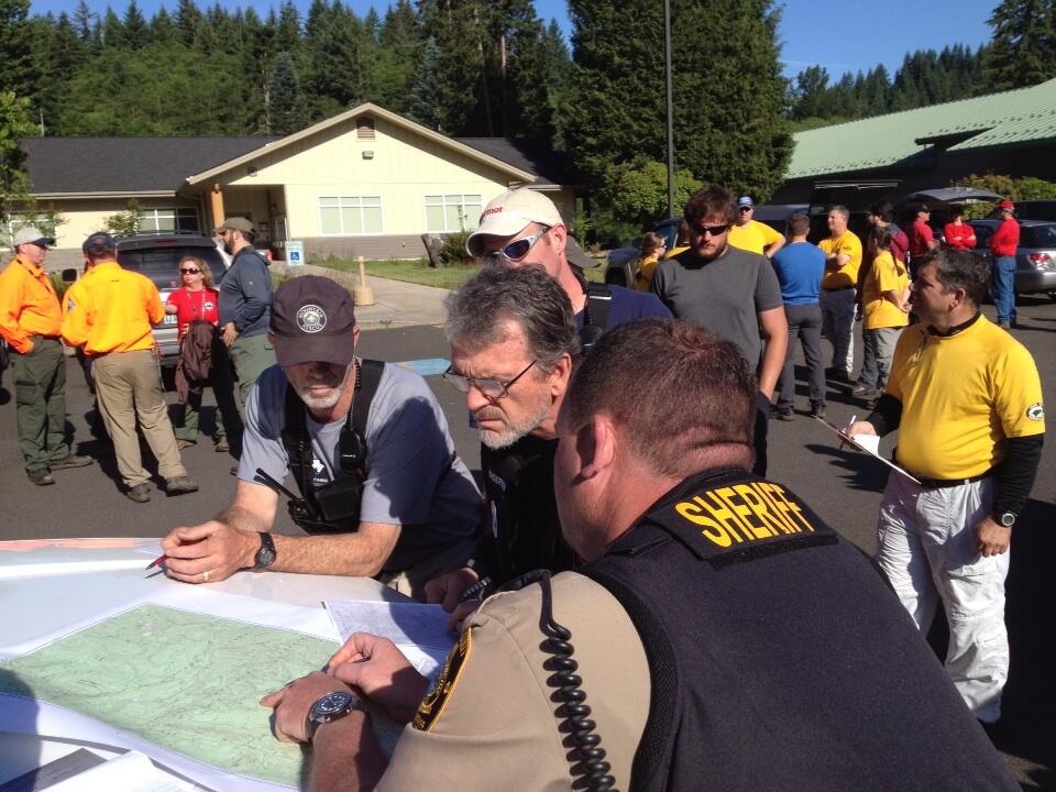 Search and Rescue volunteers and law enforcement personnel gathered in Amboy early Saturday before renewing a search for a Vancouver woman who went missing on a hike on June 9 in the Gifford Pinchot National Forest.