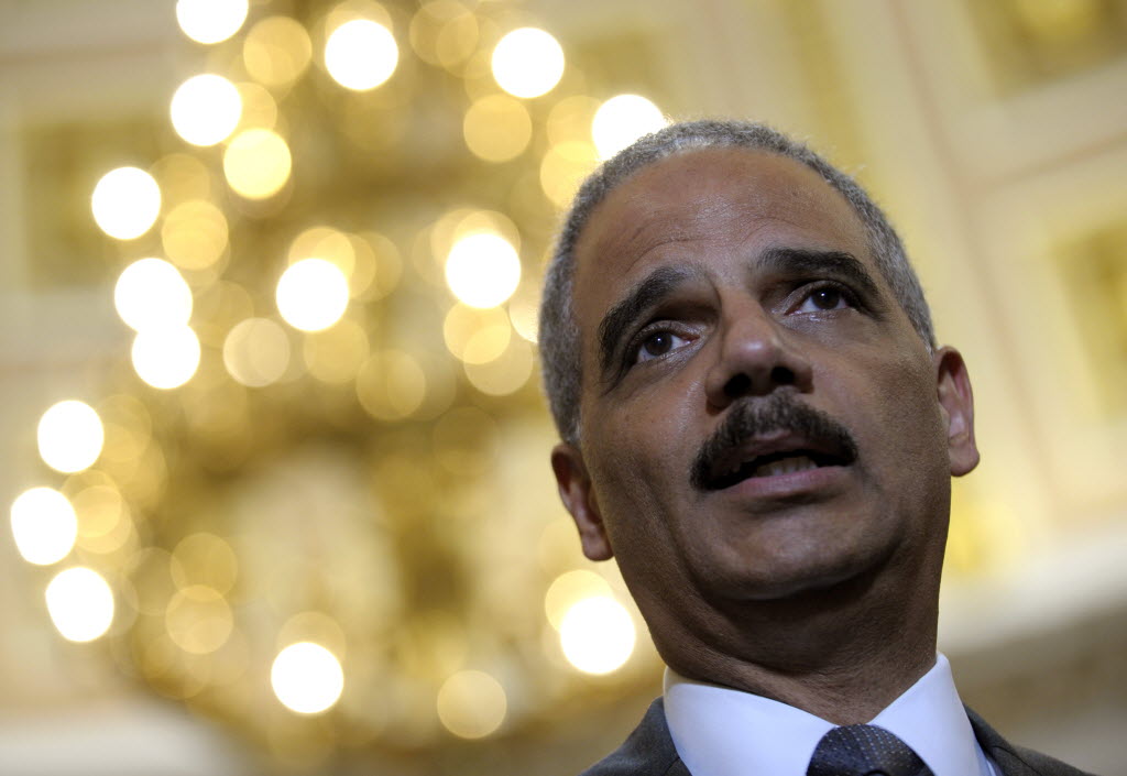 Attorney General Eric holder speaks to reporters following his meeting on Capitol Hill in Washington on Tuesday.