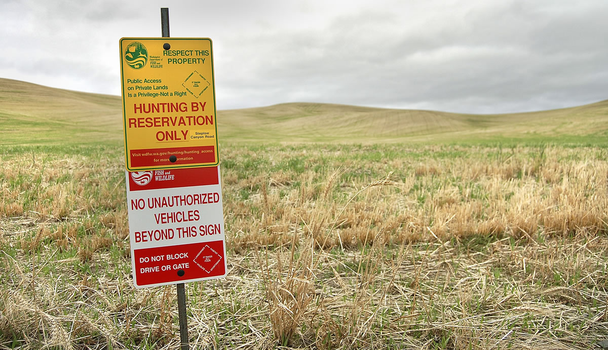 Washington's &quot;Hunt by Reservation'' lands are marked by colorful signs.