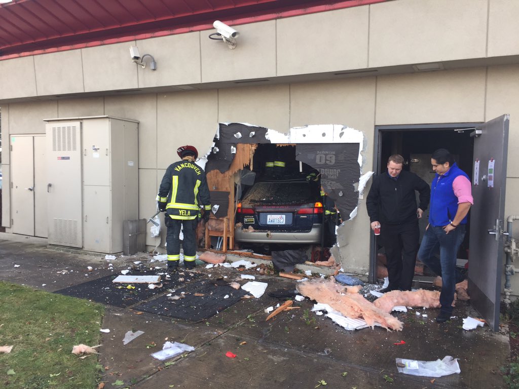 Firefighters saw though the side of the Jack-in-the-Box on 117th Avenue in Vancouver to get a Subaru out of the building. One employee and a driver were injured.