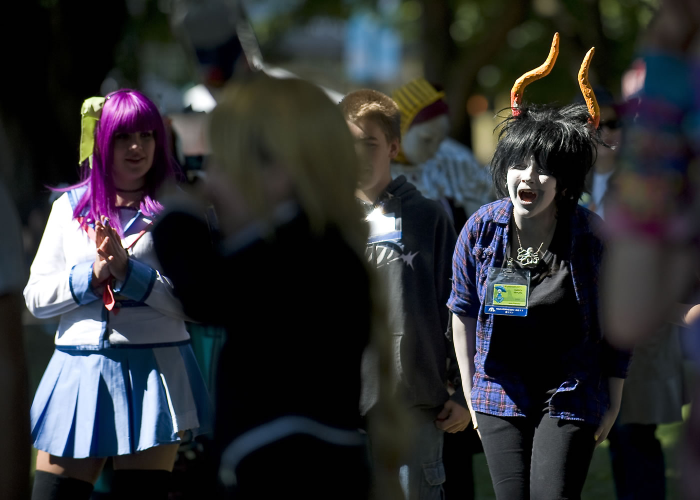 Jade Ramsey, right, 14, of Portland, who is dressed as MS Paint Adventures character &quot;Gamzee Makara&quot; gathers with other Kumoricon 2011 participants at Esther Short Park last September.