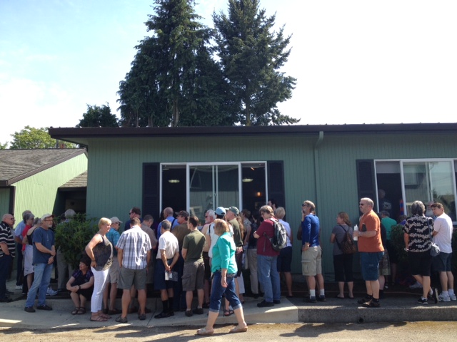 Community members listen through windows Saturday after an overflow crowd showed up Saturday afternoon for a meeting at a union hall in Vancouver's Fruit Valley neighborhood to discuss recall and other options about Clark County commissioners David Madore and Tom Mielke.