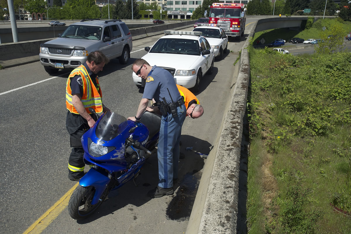 A rider was ejected off of his motorcycle after he crashed on the state Highway 14 overpass and landed on Interstate 5 just after 12:30 p.m.