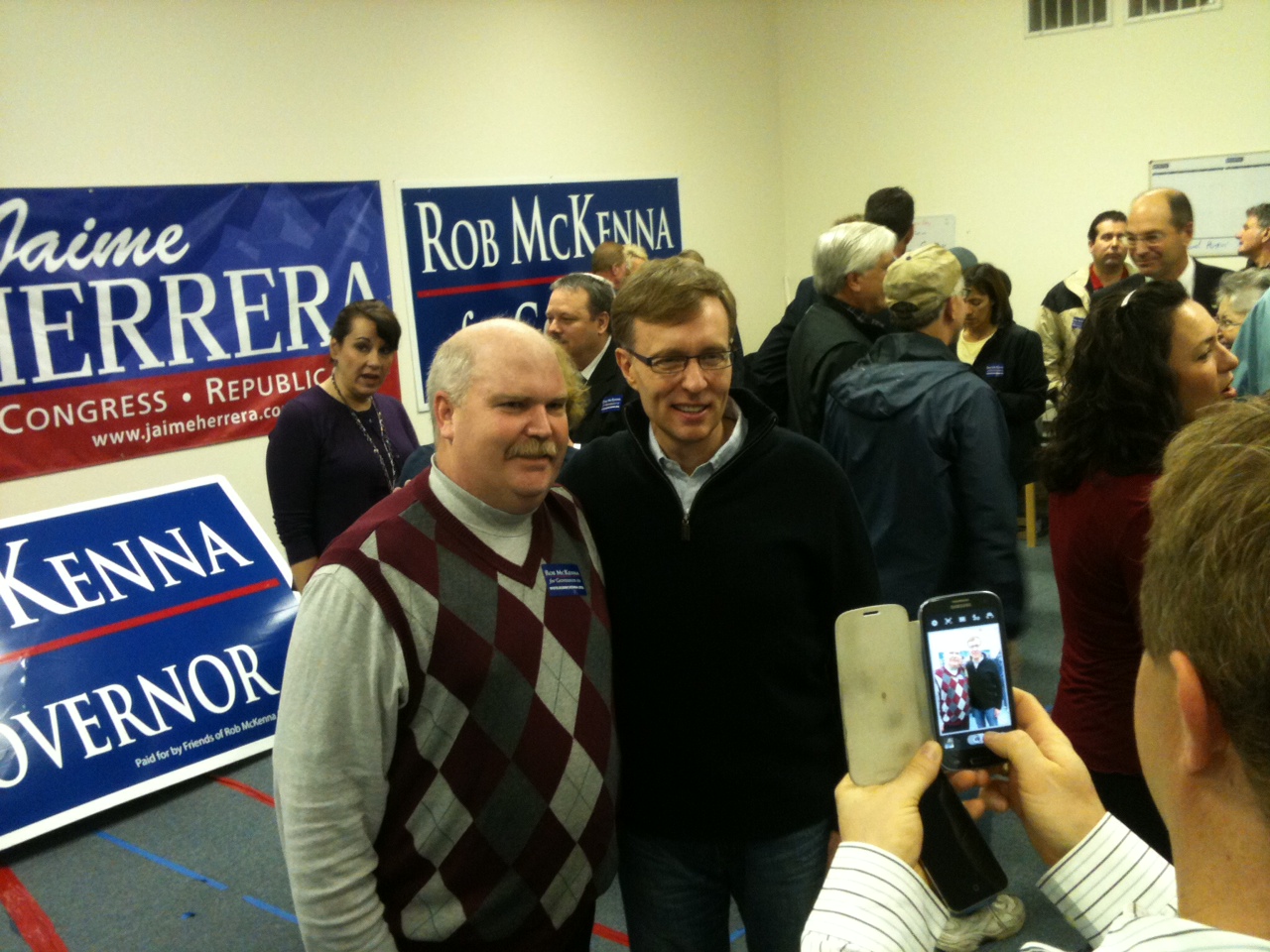 Republican gubernatorial candidate Rob McKenna poses for a photo with former La Center City Councilman Troy Van Dinter at a Hazel Dell rally today.