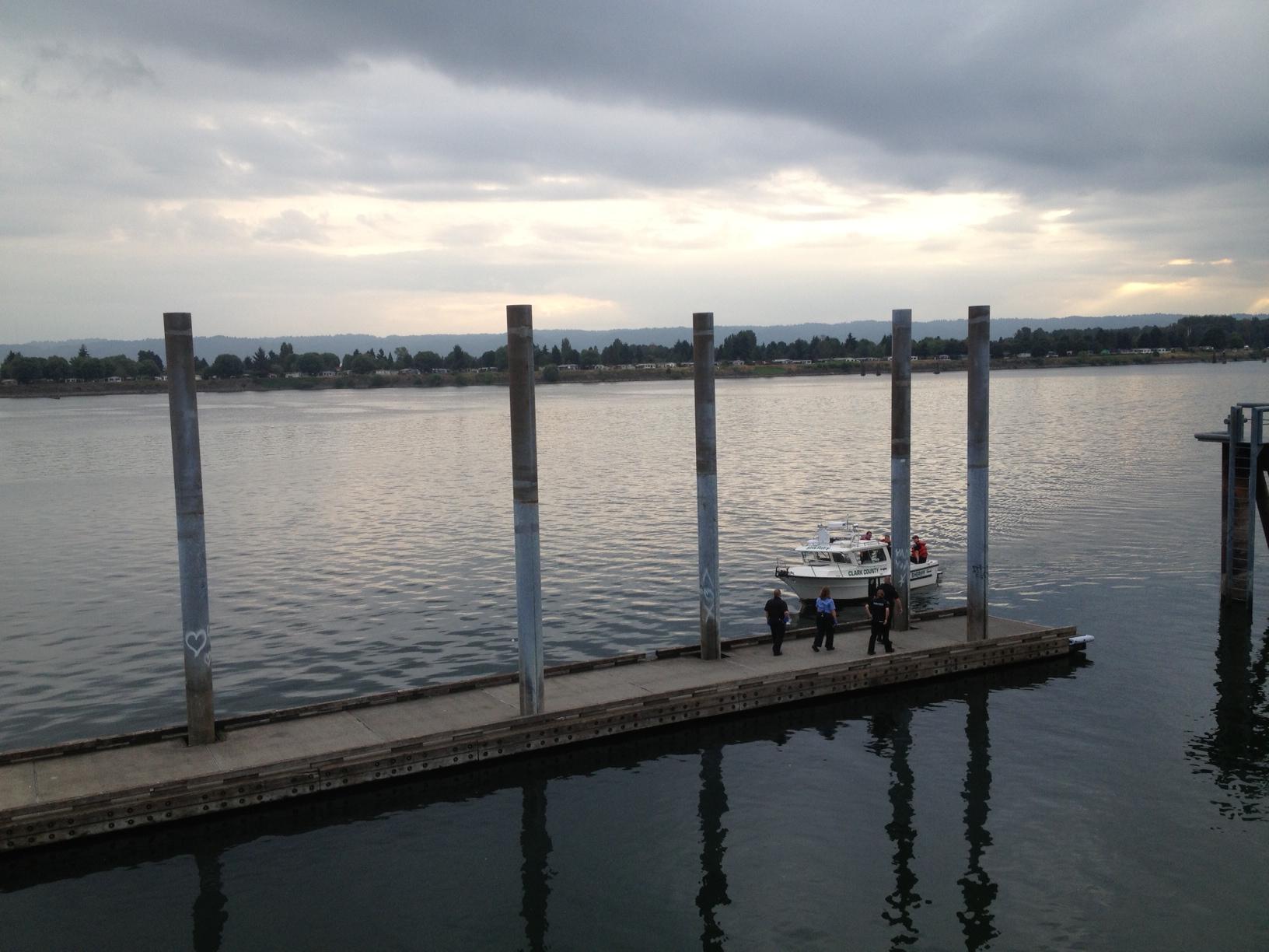 A Clark County Sheriff's Office boat approaches the dock at Vancouver Landing after a body was recovered Wednesday evening just downstream in the Columbia River.
