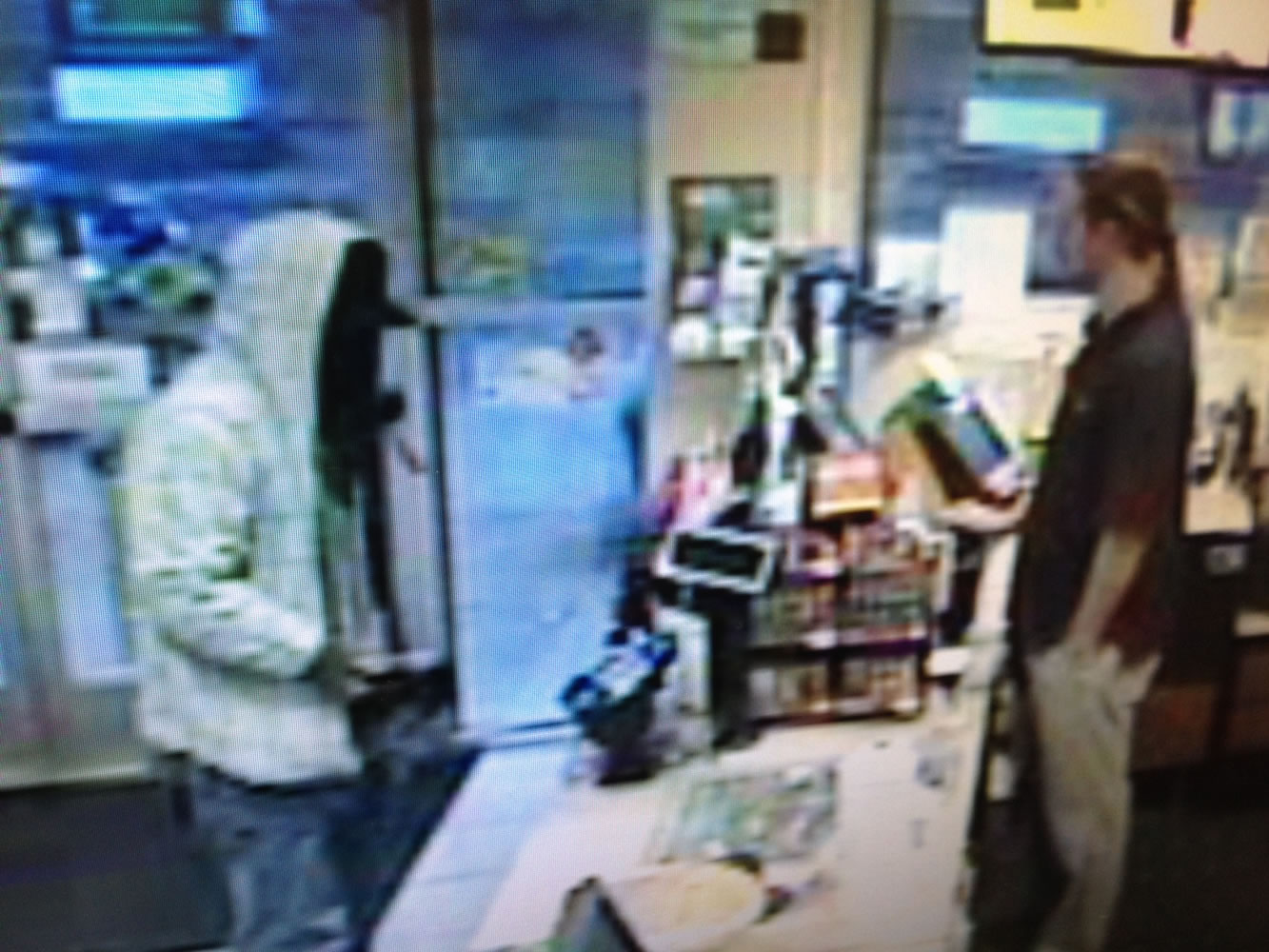 Surveillance photo shows suspect in a reported robbery at a Chevron station, 16406 S.E.