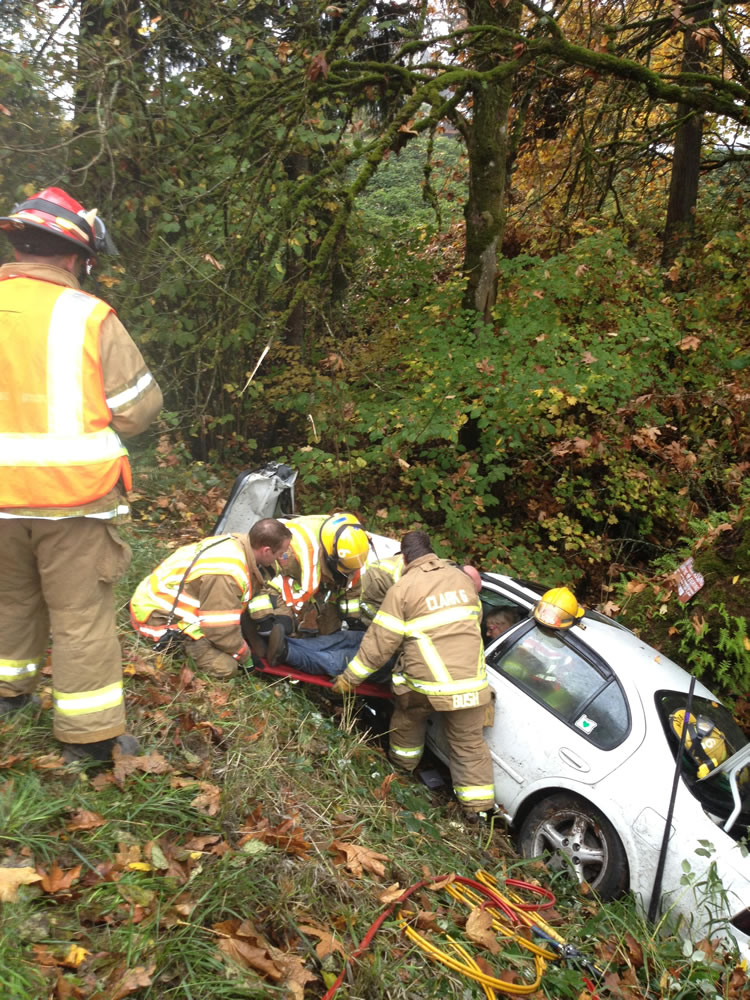 Firefighters with Clark County Fire &amp; Rescue and Clark County Fire District 6 pulled a 17-year-old teen out of a car near Ridgefield Tuesday morning.
