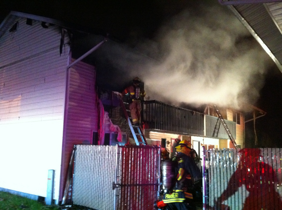 Crews fight a fire at an apartment complex early Sunday.
