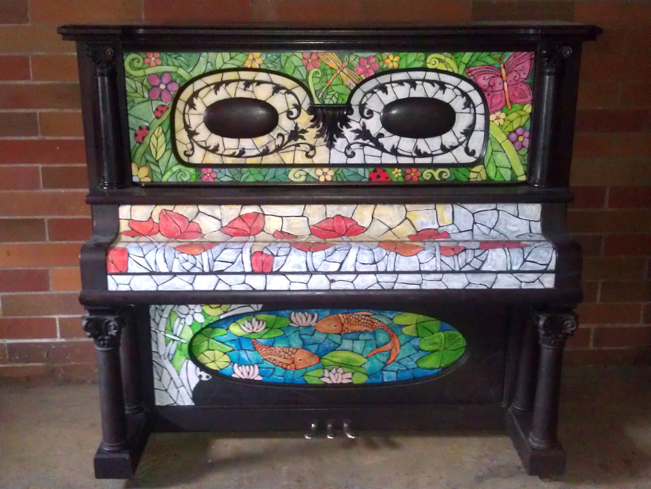 The &quot;Stained Glass&quot; piano, painted by artist Natalie Andrzejesk, took 60 hours to decorate. It will be on display at Riverview Tower Lobby, 900 Washington St.