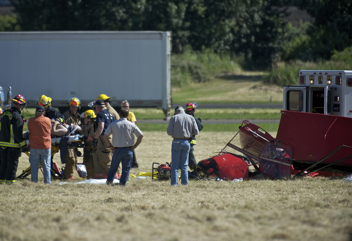 Firefighters respond to the crash of Hannibal Woodward's light plane at Pearson Field on June 27, 2012.